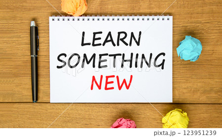 Learn something new symbol. Concept words Learn something new on beautiful white note. Black pen. Beautiful wooden background. Business motivational lifestyle learn something new concept. Copy space. 123951239