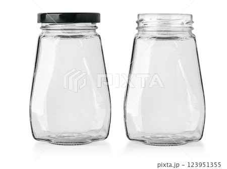 Two empty glass jars showing open and closed with black cap 123951355