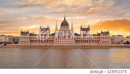 Hungarian parliament building reflecting on danube river at sunset in budapest 123951373