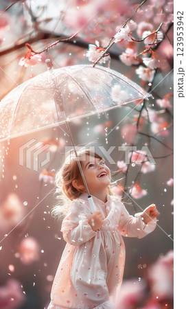 Young girl enjoying a spring day under a clear umbrella surrounded by blooming cherry blossoms. Young girl enjoying a spring day under a clear umbrella surrounded by blooming cherry blossoms. 123953942