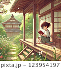 春の庭先で本を楽しむ少女 123954197