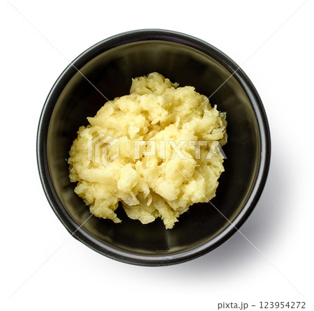 bowl of grated ginger bowl of grated ginger 123954272