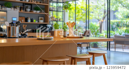 modern kitchen in smart home featuring wooden island, plants, and natural light 123959472