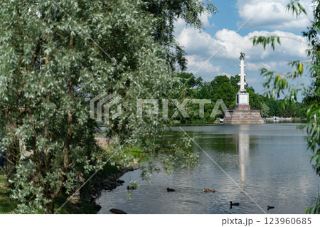 A willow leans over the Big Pond of the Catherine Park. The Chesme Column rises A willow leans over the Big Pond of the Catherine Park. The Chesme Column rises 123960685