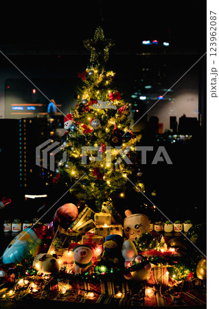 Nativity Scene with Christmas Tree and Balloon Decorations in Office Festive Atmosphere with Santa Claus. High quality photo Nativity Scene with Christmas Tree and Balloon Decorations in Office Festive Atmosphere with Santa Claus. High quality photo 123962087
