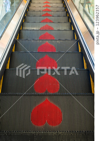 Heart Patterns Displayed on an Escalator Creating a Unique and Colorful Experience Heart Patterns Displayed on an Escalator Creating a Unique and Colorful Experience 123962357