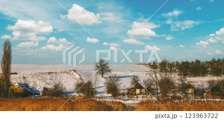View of a small village on the hill covered with snow in winter. Horizontal banner 123963722