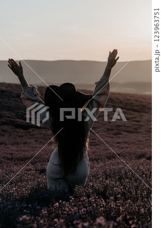 Woman in a Lavender Field at Sunset Woman in a Lavender Field at Sunset 123963751
