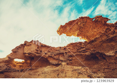 Duna Fosil de Los Escullos against a cloudy sky. Rocky landscape. Nature background 123963929
