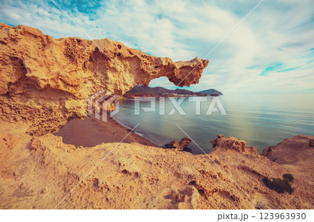 Duna Fosil de Los Escullos against a cloudy sky. Rocky landscape. Nature background 123963930