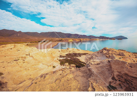 Duna Fosil de Los Escullos against a cloudy sky. Rocky landscape. Nature background 123963931
