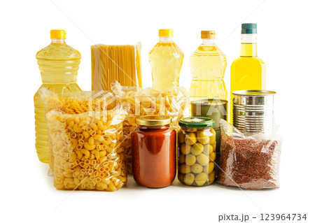 Foodstuffs in donation box isolated on white background for volunteer to help people. Foodstuffs in donation box isolated on white background for volunteer to help people. 123964734