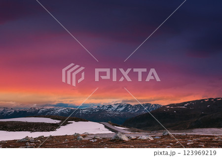 Scandinavia. Amazing Scenic View Of Norwegian Mountains. Scenic Mountain Route Road In Autumn Day. Bright Magenta Cloudy Sky Above Norwegian Scenic Landscape. 123969219