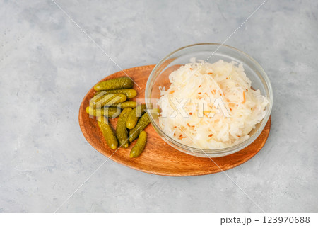Sauerkraut and pickled cucumbers on neutral background 123970688