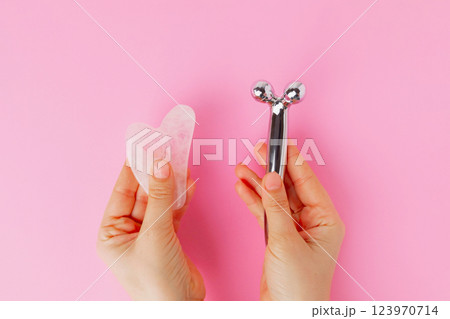 Face tools roller and quartz gua sha 123970714