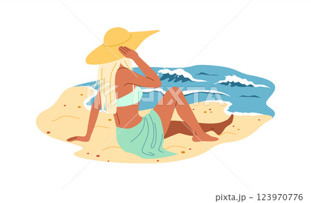 Woman Relaxing on Beach with Ocean View 123970776