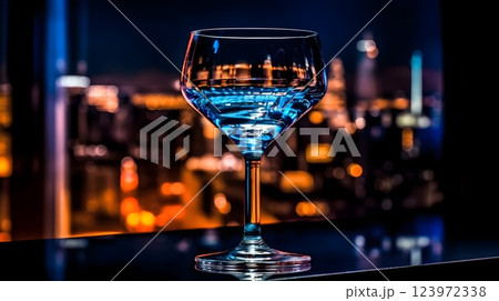 Elegant Blue Cocktail with Cityscape Backdrop Elegant Blue Cocktail with Cityscape Backdrop 123972338