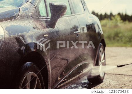 Car wash using high pressure water Car wash using high pressure water 123973428