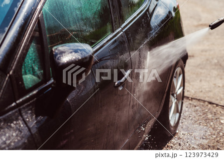 Car wash using high pressure water Car wash using high pressure water 123973429