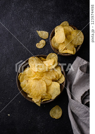 Crispy salty homemade potato chips 123974498