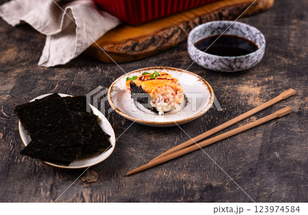 Baked sushi roll cake with crab surimi sticks 123974584
