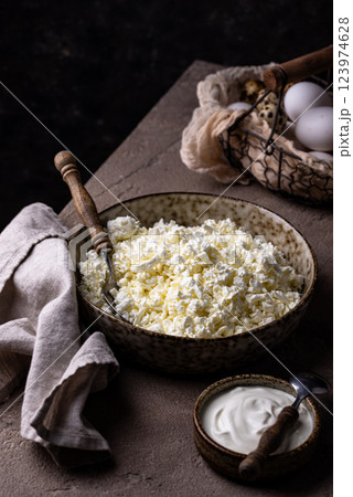 Cottage cheese on light background 123974628