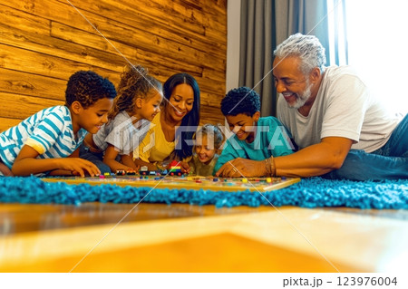 Enjoying Quality Family Bonding Time Playing Fun Games Together for Lasting Memories 123976004