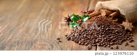 A delightful arrangement of festive coffee and a variety of spices displayed on a wooden table 123976110