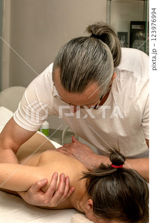 Professional massage therapist 123976994
