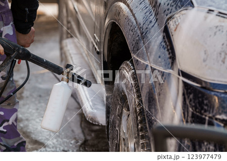 Pressure Washing Vehicle with Foam and Soap for Deep Cleaning Car Exterior and Wheels Pressure Washing Vehicle with Foam and Soap for Deep Cleaning Car Exterior and Wheels 123977479