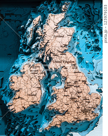Wooden outline map of the UK and Ireland on the wall. Plywood mainlands, laser cut. Wooden outline map of the UK and Ireland on the wall. Plywood mainlands, laser cut. 123979103