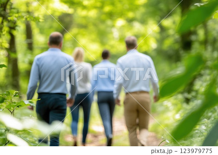 Employees on a nature walk, engaging in team discussion 123979775