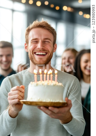 Modern Office Birthday Celebration with Cake in Hand 123980993