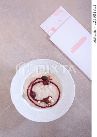 Homemade rice porridge for breakfast. Porridge with blackberries. View from above. Healthy food. Top view. 123981811