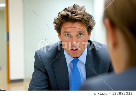 Employee receiving harsh feedback from boss 123982032