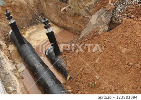 A break in the water pipeline. Repairs A break in the water pipeline. Repairs 123983094