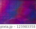 A vibrant, textured surface featuring a mesmerizing blend of purple, pink, and blue hues, reflecting light in a geometric pattern. 123983358