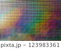 A vibrant, iridescent pattern of diamond shapes reflecting various colors, creating a mesmerizing visual effect reminiscent of art and design. 123983361