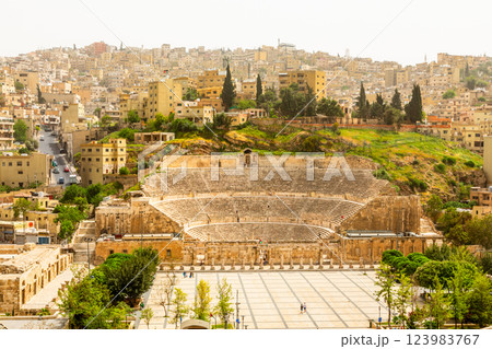 Ancient roman amphitheater and many residential houses on the hills in Al Balad downtown of Amman city, Kingdom of Jordan Ancient roman amphitheater and many residential houses on the hills in Al Balad downtown of Amman city, Kingdom of Jordan 123983767
