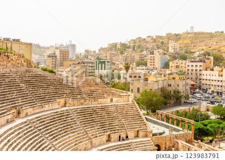 Ancient Roman amphitheater and many residential houses on the hills in Al Balad downtown of Amman city, Kingdom of Jordan Ancient Roman amphitheater and many residential houses on the hills in Al Balad downtown of Amman city, Kingdom of Jordan 123983791