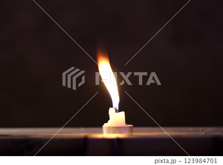 Flame Of Tablet Candle Fluttering In Wind Close Up Flame Of Tablet Candle Fluttering In Wind Close Up 123984701
