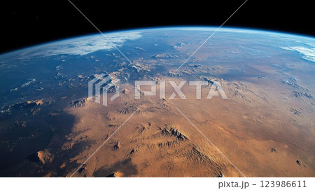 Earth Reveals Vast Desert Landscape from Space with Majestic Mountains and Atmospheric Perspective. Earth Reveals Vast Desert Landscape from Space with Majestic Mountains and Atmospheric Perspective. 123986611