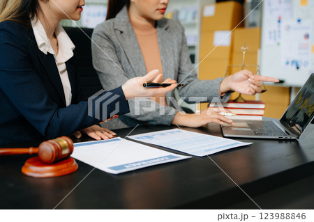 Business and lawyers discussing contract papers with brass scale on desk in office. Law, legal services, 123988846