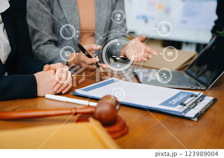 business people and lawyers discussing contract papers sitting at the table. Concepts of law, advice, legal services. business people and lawyers discussing contract papers sitting at the table. Concepts of law, advice, legal services. 123989004