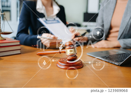 Copyright or patent concept, Business team analyzing data and using smart phone and tablet with virtual screen Copyright or patent concept, Business team analyzing data and using smart phone and tablet with virtual screen 123989068