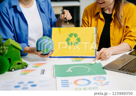 business team people planning and discussing on recycle reduce reuse policy symbol in office meeting room. 123989350