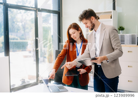 Portrait of success business people working together in modern office. 123989996