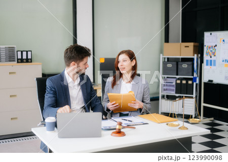 Modern lawyer office a professional discussion, legal documents, and teamwork. Perfect Modern lawyer office a professional discussion, legal documents, and teamwork. Perfect 123990098