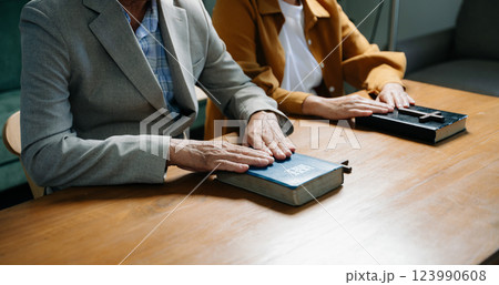 Christians are congregants join hands to pray and seek the blessings 123990608