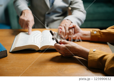 Christians are congregants join hands to pray and seek the blessings 123990632